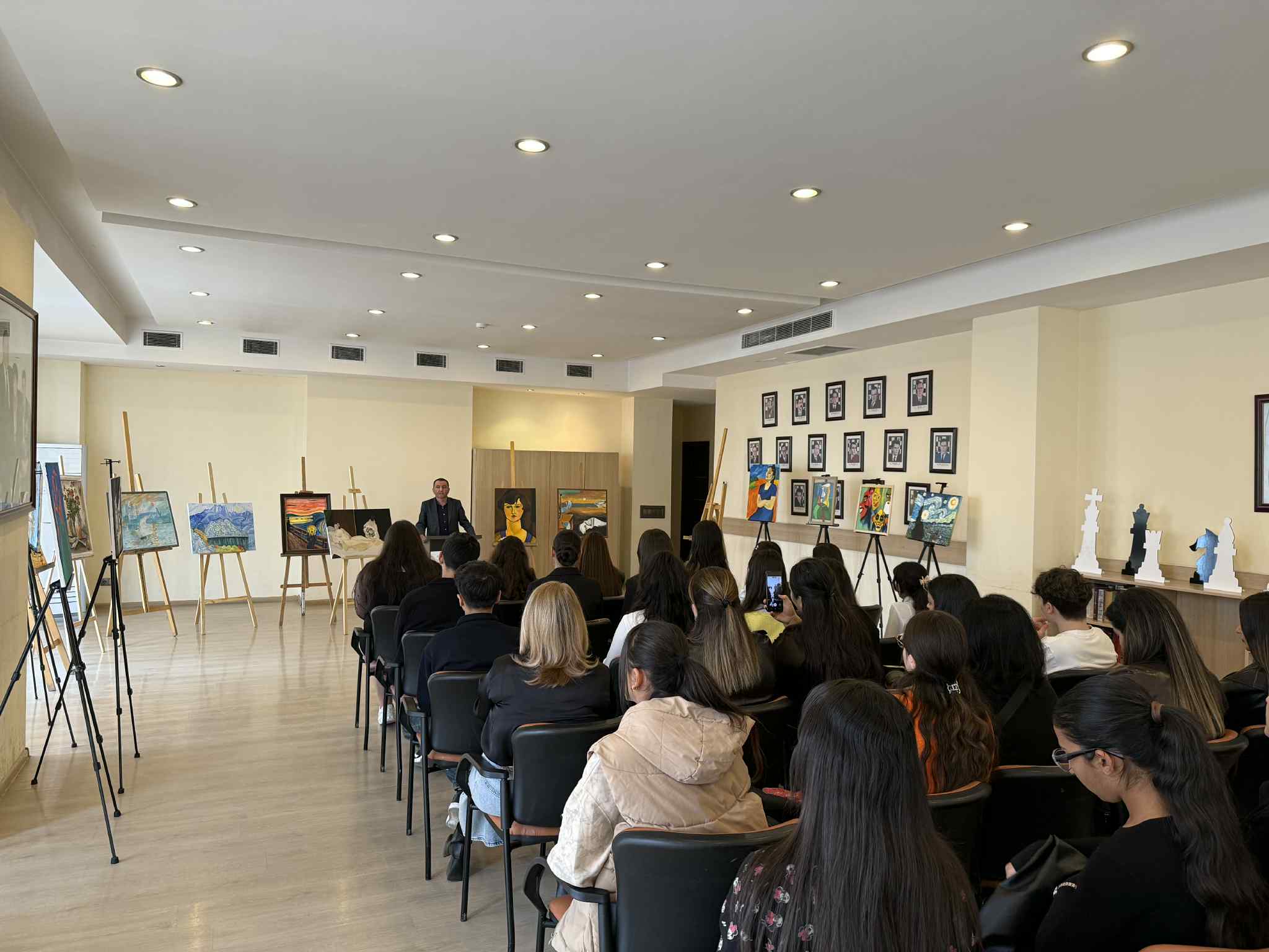 At the Tea House, future artists made presentations to their parents